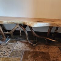 Handcrafted elk antler bench with live edge burl wood top by Montana Antler Works
