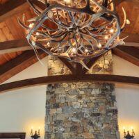 Holland Peak 19-light mule deer and elk antler chandelier in a vaulted great room