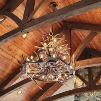 Holland Peak Large trophy elk and mule deer antler chandelier in a rustic great room