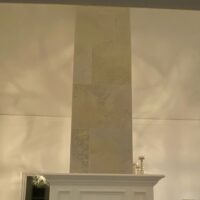 pair of round white deer antler chandeliers in restaurant