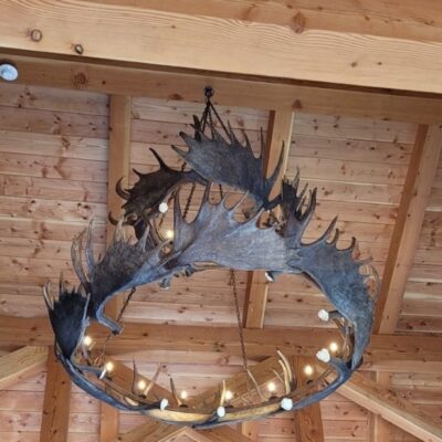 Large moose antler chandelier in barn
