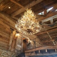 Mountain retreat with large whitetail antler chandelier