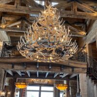 Rustic mountain lodge with large whitetail antler chandelier