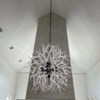 white deer antler chandelier in dining room