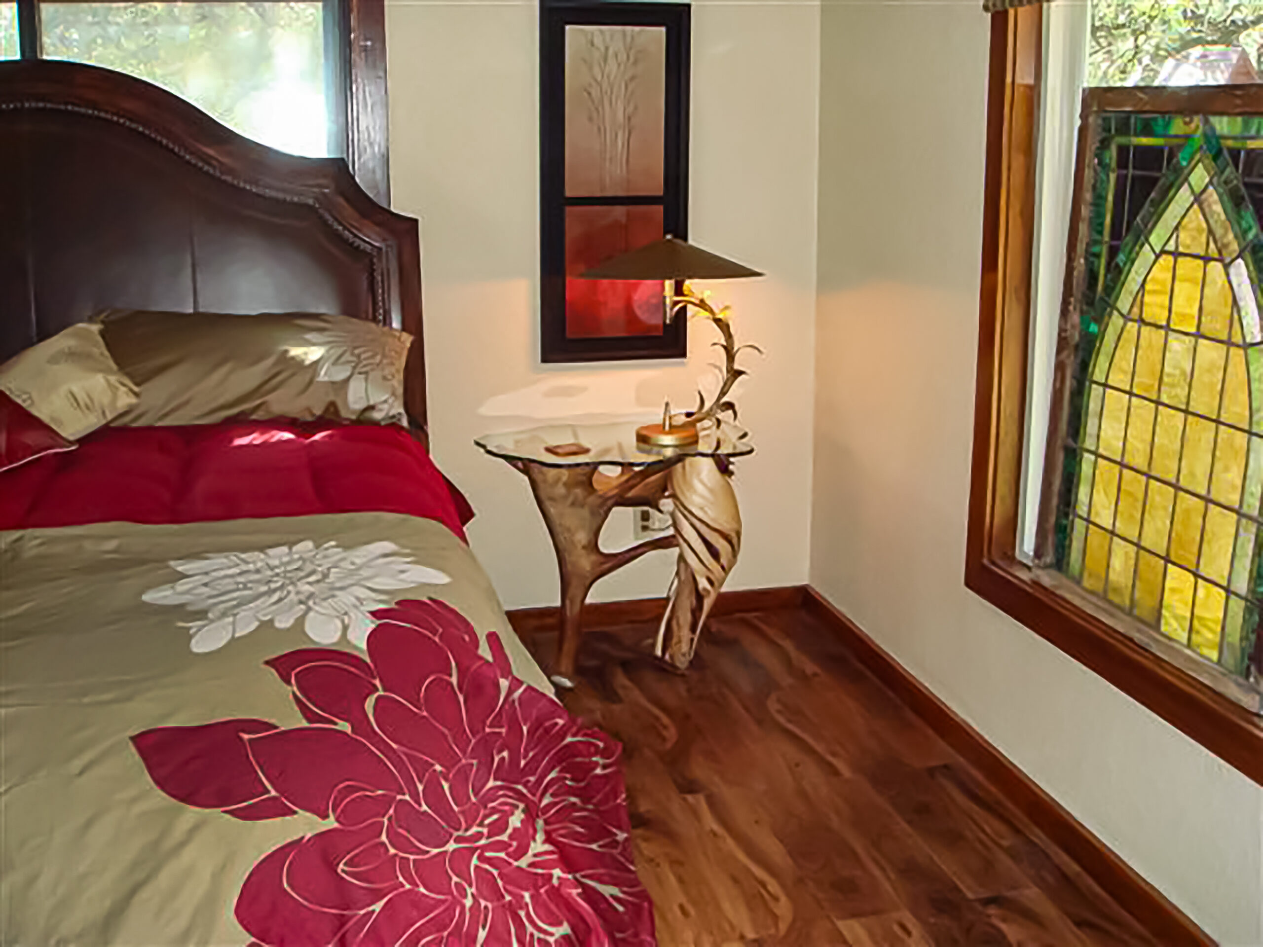 Handcrafted antler and burl wood end table with natural textures and rustic lodge design