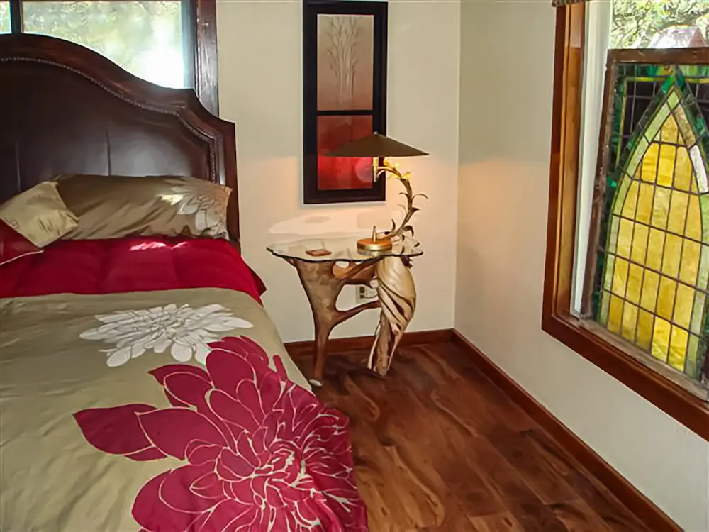 Handcrafted antler and burl wood end table with natural textures and rustic lodge design